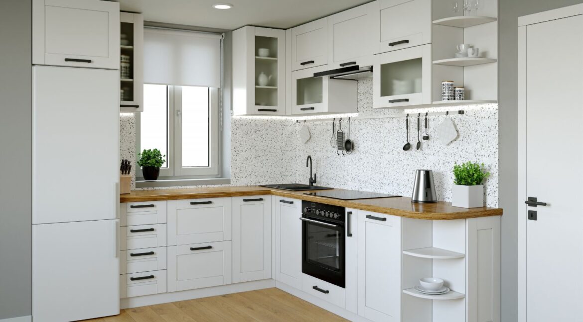 Compact kitchen with white cabinets, wooden countertop, and wall-mounted utensils for efficient storage.